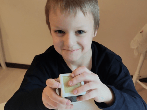 Kid playing with Toucheys cube